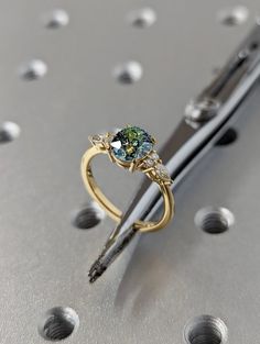 a close up of a pen with a ring on it