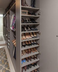 an organized closet with lots of shoes