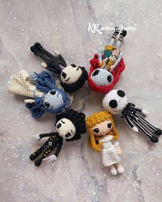 there are knitted keychains made to look like cartoon characters