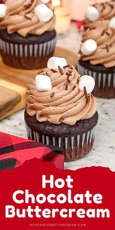 chocolate cupcakes with marshmallows on top and the words hot chocolate buttercream above them