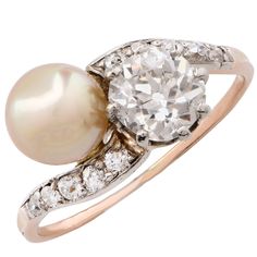 Pearl and diamond crossover ring. Old Miner cut diamond weighing 1.00 carats. GIA certified: color I, Clarity SI2. Size 6 3/4. Can be sized. Diamond And Pearl Ring, Crossover Diamond Ring, Pearl And Diamond Ring, Ringe Gold, Natural Pearl, Pearl Diamond, Vintage Jewels, Rose Cut Diamond, Gold Platinum