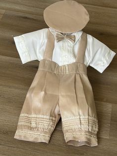 Knicker khaki outfit for your baby  boy. The outfit comes with  suspenders short pants and matching hat (silk shonton)Classy set suitable for special events like wedding, Christening, Easter or other celebration. It has a bow tie included. Made in USA. Fitted Beige Sets For Baptism, Elegant Beige Sets For Baptism, Elegant Beige Baptism Set, Hat Silk, Khakis Outfit, Easter Outfit, Jumper Shirt, Gender Neutral Baby, Outfit Set