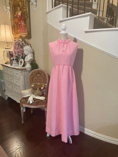 Vintage Pink 1960's Keyhole Sleeveless Dress, Handmade, guessing this is a Size 6, fabric does not have stretch and is very unique, floral applique details on neckline, great condition, just one tiny blemish on side of neckline that is hardly noticeable All items sold at Whimsy Manor are vintage and may show minor wear and tear commensurate with age. If you have any questions or need assistance please don't hesitate to contact the shop owner. All sales are final unless items arrive damaged (pictures showing damage will be required as proof). Vintage Sleeveless Party Dress, Feminine Fitted Sleeveless Vintage Dress, Fitted Sleeveless Feminine Vintage Dress, Feminine Sleeveless Vintage Dress, Pink Sleeveless Vintage Dress With Ruffles, Sleeveless Lined Vintage Dress, Retro Sleeveless Vintage Dress For Daywear, Spring Sleeveless Vintage Dress, Sleeveless Vintage Dress For Spring