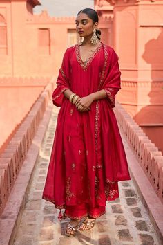 Red kurta with patra embroidery in floral pattern. Paired with a pant with patra embroidered hem and dupatta.
Components: 3
Pattern: Embroidery
Type Of Work: Patra, Floral
Neckline: V Neck
Sleeve Type: Three Quarter Sleeves
Fabric: Silk, Organza Silk
Color: Red
Other Details: 
Floral embroidered border dupatta
Note: The outfit worn by the model at the back is not for sale
Occasion: Mehendi and Haldi - Aza Fashions Red Anarkali, Easy Clothing, Chanderi Dupatta, Red Kurta, Diwali Outfits, Printed Embroidery, Cotton Dupatta, Hand Work Embroidery, Kurta With Pants