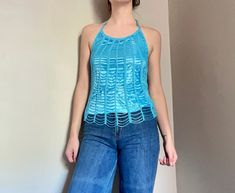 "Super fun going out top. Halter neck, crochet sides, gorgeous metallic blue beading.  Label: Le Chateau Material: 100% Rayon Condition: Excellent, like new.  Size Large Measurement (has stretch): Bust (underarm band): 32\" Waist: 32\" Length from top of neckline: 19\"" Halter Neck Crochet, Faux Turtleneck, Beaded Halter Top, Womens Halter Tops, Top Halter, Le Chateau, Halter Tops, Flight Jacket, Going Out Tops