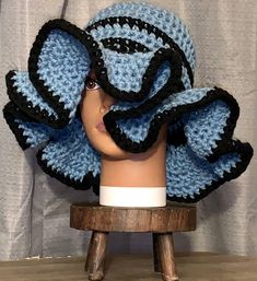 a crocheted hat on top of a mannequin head