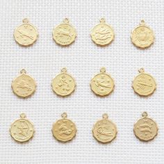 Our dainty zodiac coin necklace features a round scalloped pendant with a zodiac sign on it. …………………………………. Details: Pendant is Gold or Silver Plated over Brass measuring 12mm Chain is 14k Gold/Silver Plated, Gold Filled or Sterling Silver Average necklace length is 18" About Your Jewelry If you are not wearing your jewelry it is best to store it in a cool, dry place such as your gift box that is included in your ord 14k Gold Zodiac Sign Medallion Jewelry, Silver Zodiac Sign Jewelry Gold Plated, Yellow Gold Zodiac Sign Jewelry, Celestial 14k Gold Coin Pendant Jewelry, Celestial Jewelry With Round Pendant Charms, Yellow Gold Coin-shaped Charms Jewelry, Yellow Gold Coin-shaped Jewelry With Charms, Yellow Gold Coin Shaped Jewelry With Charms, Celestial Zodiac Sign Gold-plated Jewelry