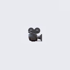 an image of a camera that is on the side of a white wall with no background