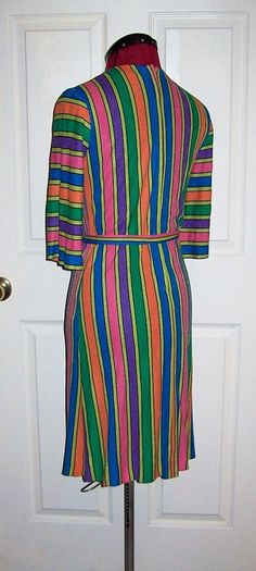 "Vintage 1960s Ladies Multi Color Striped Dress a Mary Muffett Original Small Bust =32\" 3/4 Sleeves, Back Zipper, Tie Belt, Mod Good Vintage Condition* Only $300 Waist =30\" Hips =34\" Shoulder to Shoulder =14 1/2\" Back Collar to Hem =37\" Sleeves Shoulder to Cuff =15\" *Small Hole on Shoulder, No Other Flaws -See Photos Note: This is the ONLY Known surviving Example of a Mary Muffet Dress with Label from the 1960s, there may be more stashed away in someone's closet, but currently no others se Garment Industry, Flowy Tops, Color Stripes, Vintage 1960s, Tie Belt, Small Bust, Short Sleeve Blouse, Shoulder Sleeve, Striped Dress