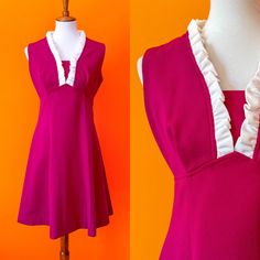 "Groovy Magenta Mini Dress 🧁 Super cute and perfect for layering or wearing alone! Polyester with some stretch. Zipper up the back. See measurements to ensure desired fit! MEASUREMENTS: *taken flat, double where needed* TOTAL LENGTH: 35\" CHEST: 18\" WAIST: 16.5\" HIPS: 22\" CONDITION: Great vintage shape! Some minor color bleeding on the inside of the white ruffles. See photos. SHOP POLICY: Thank you for your interest! All sales completed with Sunny Girlfriend Retro are final. Buyers are responsible for checking measurements of garments for correct sizing, examining all photos, and reading the entire description before purchasing. By choosing to purchase from this shop, you are agreeing to these terms. Please feel free to ask any questions you may have!" 1960s Color Block Dress, Retro V-neck Dress With Ruffles, A-line Sleeveless Dress With Ruffles For Daywear, Pink Fitted Sleeveless Dress With Ruffles, Fitted Pink Sleeveless Dress With Ruffles, Fitted V-neck Ruffle Dress For Daywear, Fitted Ruffle Dress For Daywear, Retro Pink Ruffled Dresses, Pink Retro Dresses With Ruffles