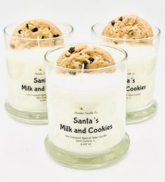 three candles with cookies in them sitting next to each other