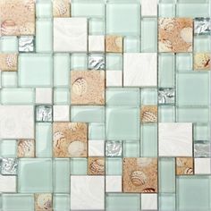 a mosaic tile wall with different colors and shapes