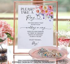 a sign that says please take a ring and not to say wedding rings on it