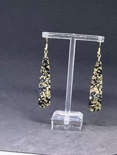 Want something tropical? It's our shell type theme long black gold leaf spec earrings. Absolutely stunning lightweight perfect for a night at time. Perfect for any summer outfit. Absolutely gorgeous you don't wanna miss this piece. It's just beautiful. It's lightweight. Perfect way to work for any outfit. Beautiful gold leaf spec,  Copper free  lightweight. Perfect for if you  long earrings. They also make great gifts. Perfect for any summer outfit and all your summer needs. For beach parties, p Summer Needs, Beach Parties, Fun Earrings, Long Black, Long Earrings, Gold Leaf, Summer Outfit, Jewelry Earrings Dangle, Etsy Earrings