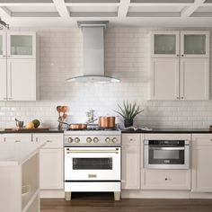 a kitchen with an oven, stove and counter tops in white painted wood flooring