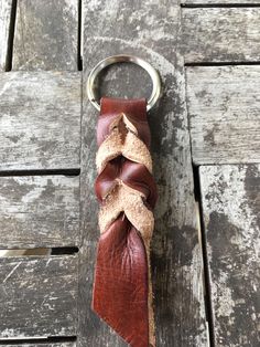 a leather keychain with a piece of fabric wrapped around it