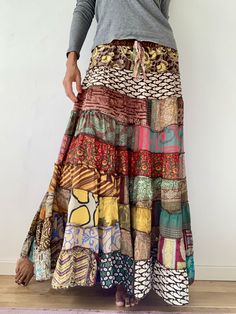 This gorgeous hippie skirt is always fun to wear,  True boho and gypsie style inspired long and flowy perfect summer party skirt it is free size and floor length always one of a kind  patchwork, made of varieties of different fabrics with floral patterns,  very easy to wear and comfy  it has elasticated waist band, and will fit most of sizes S-L MEASURE One Size Fits Most length 39 inch/100 cm waist 28-40 inch / 66-100cm  CARE * Hand wash recommended * Hang to dry It is perfect outfit for everyd Summer Party Skirt, Skirt Tiered, Hippie Skirt, Festival Skirts, Hippie Skirts, Womens Skirts, Patchwork Skirt, Floral Maxi Skirt, Party Skirt