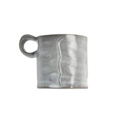 a silver mug with a curved handle on a white background, it is made out of concrete