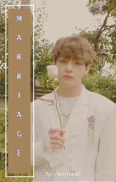 a young man holding a flower in front of his face with the words marriage on it