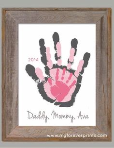 a handprint is displayed in a frame with the word daddy's mommy - ava on it