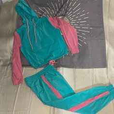 Rusty- Carla Tracksuit Turquoise Baby Pink Give This A Size: Small 80’s Style Crop Track Jacket And Jogger Pants! Never Used, Nwt Casual Pink Color Block Sets, Pink Turquoise, Track Jacket, Track Jackets, Jogger Pants, Baby Pink, Pant Jumpsuit, Pants For Women, Track