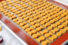 the cookie sheet is lined with heart shaped cookies and ready to go into the oven