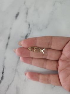 ♥ Product Summary ♥Metal: 14K Yellow GoldWeight: 1 gramDimensions: 26mm x 8mm Elegant 14k Gold Fish-shaped Jewelry, Cross Pendant, Cut Out, Yellow Gold, Fish, Pendant, Yellow, Pattern, Gold