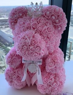 a pink teddy bear made out of flowers