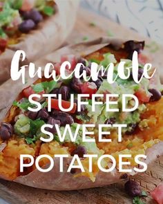 two loaded sweet potatoes with guacamole and black beans