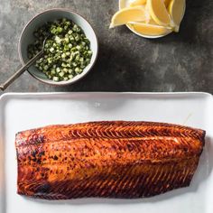 the fish is prepared and ready to be served on the table with other dishes around it