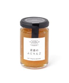 an open jar of honey on a white background