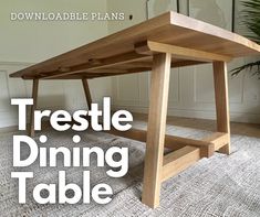 a wooden table with the words trestle dining table on it's bottom corner