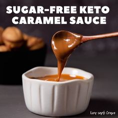 a spoon full of caramel sauce being drizzled into a small white bowl