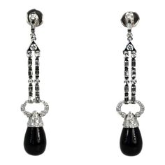 This is part of Chairish’s Fine Jewelry assortment.  These lovely earrings are set with round Diamonds, baguette Diamonds and pave Diamonds all with an Onyx drop. They are 2 1/4" long, Onyx is 9.17cm wide x 12.55cm long and weight 11.9 grams. These earrings are from Spain and the setting is gorgeous, baguettes alternate between round Diamonds with a pave of Diamonds heading the Onyx. Perfect you will keep these in your collection forever. I love black onyx and I do have a few important pieces bu Timeless Evening Earrings With 17 Jewels, Luxury Long Drop Earrings For Formal Occasions, Classic Polished Diamond Earrings For Evening, Timeless Diamond Earrings With Pave Setting For Evening, Exquisite Earrings With Pave Setting For Evening, Fine Jewelry Earrings With Pave Setting For Evening, Fine Jewelry Long Drop Earrings For Evening, Classic Evening Earrings With Baguette Cut, Evening Fine Jewelry Long Drop Earrings