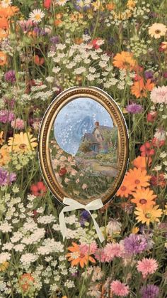 a mirror sitting on top of a field of flowers