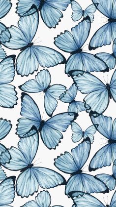 many blue butterflies flying in the air