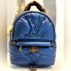 Wow This Bag Is Straight From The Runway, This Super Rare Bag Is In The Limited Edition Blue Pillow Fabric Design, With Canvas Tan And Accents. In Excellent Condition. This Bag Is Not New And Has Been Carried But It’s In Excellent Shape. Yes, It’s Authentic My Price Is Firm Trusted Seller With Many Lv Bag Sales Comes With The Mono Straps (To Wear As Backpack) Lightweight And Ultra Comfy To Wear Limited Edition And Sold Out. Ships With The Lv Box, Product Care Tags Thanks For Looking And Happy Po Designer Blue Backpack, Luxury Blue Standard Backpack, Designer Blue Standard Backpack, Designer Blue Backpack For Everyday Use, Designer Blue Backpack For Daily Use, Luxury Blue Backpack Bag, Luxury Blue Backpack, Palm Spring Mini, Louis Vuitton Palm Springs Mini