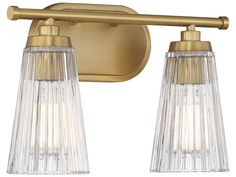 two light bathroom fixture with gold finish and clear glass shades on the bulbs, one bulb is