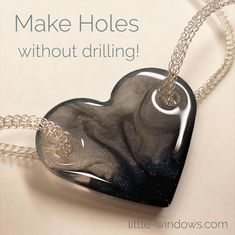 a heart shaped glass pendant on a chain with the words make holes without drilling above it