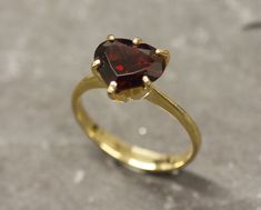 Gold Garnet Ring set with a Natural Garnet in a perfect diamond cut & a deep red color, from Mozambique, at 10x8mm, 3.5 Carats. Promise Ring design made of Gold Vermeil ☞ thickest 18k Gold Plating on top of Solid 925 Sterling Silver ☞ made to last. ☞ Choose your size ☞ I resize (before shipping) for FREE to Any size* Matching Earrings & Matching Pendant - please ask me January Birthstone - Genuine & Natural Stones ❀ ⌛Last Ring left ⌛ ❀ Each Natural Gem is unique & will have Slight variations fro Heart Shaped Solitaire Ring For Formal Occasions, Classic Heart-shaped Ruby Ring For Formal Occasions, Formal Heart-shaped Solitaire Rings, Formal Heart Shaped Solitaire Ring, Classic Heart-shaped Ruby Ring, Hallmarked Heart Ring For Valentine's Day Formal, Formal Hallmarked Heart Ring For Valentine's Day, Classic Heart-shaped Red Ruby Ring, Classic Red Heart-shaped Ruby Ring