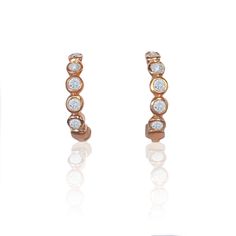 Petite diamond and rose gold huggies. 5 petite diamonds in each earring, 10 diamonds total Measures 5/8" tall 14k rose gold Made to order Classic Rose Gold Huggie Earrings With Single Cut Diamonds, Rose Gold Single Cut Diamond Huggie Earrings For Anniversary, Rose Gold Small Hoop Diamond Earrings, Rose Gold Hoop Earrings With Single Cut Diamonds, Rose Gold Vvs Clarity Huggie Diamond Earrings, Fine Jewelry Rose Gold Huggie Earrings With Diamond Cut, Rose Gold Small Hoop Huggie Earrings With Diamond Accents, Rose Gold 14k Huggie Diamond Earrings, Rose Gold Diamond Hoop Earrings With Single Cut Diamonds