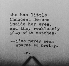 an old typewriter with the words she has little innocent demons inside her eyes and they recklessly play with matches