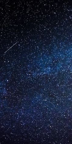 the night sky is filled with stars and an airplane flying in the air above it