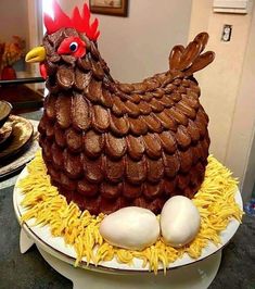 a cake made to look like a chicken with eggs in it's nest on a plate