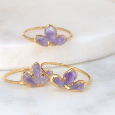 Buy any 3 items, get 20% off! (Note: Coupons cannot stack) A simple amehtyst ring with a comfortable dainty ring shank. Stacks well with other colored gemstone rings. Amethyst are the birthstone for February! However, these gems are super trendy and can be worn by anyone who loves purple and gold. ✨ Natural, uncut Amethyst Gem size – 3-5mm 14k Gold Fill Shank 24k Gold Dipped ✨ The ring shank is made entirely with 14k gold filled wire, which has been plated with 24k gold for more intense color. U Dainty Amethyst Gemstone Stackable Rings, Dainty Amethyst Stackable Rings, Dainty Amethyst Stackable Rings For Promise, Dainty Stackable Amethyst Ring Gift, Dainty Stackable Amethyst Ring As A Gift, Amethyst Gemstone Stackable Rings As Gift, Dainty Amethyst Stackable Rings For Gift, Stackable Amethyst Jewelry, Delicate Amethyst Ring As Gift