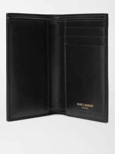 Tipping the corner of this billfold wallet is SAINT LAURENT's original monogram, designed in the '60s. It's made from smooth leather and fitted with plenty of slots for cards, receipts and cash. Designer Business Trifold Wallet, Designer Trifold Wallet With Coin Pocket For Business, Designer Trifold Wallet With Interior Card Slots For Business, Designer Trifold Wallet With Interior Card Slots, Designer Bifold Wallets For Formal Occasions, Designer Bifold Business Wallet, Designer Trifold Wallet For Formal Occasions, Designer Trifold Wallets For Formal Occasions, Luxury Leather-lined Trifold Wallet For Formal Occasions