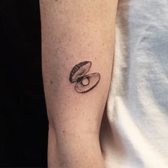 a person with a small tattoo on their arm