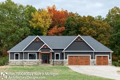 a large house with two garages in front of it and lots of trees around