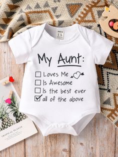 a baby's bodysuit with the words, my aunt loves me and is awesome