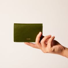 Compact cardholder with a simplistic silhouette and colorful inside, crafted from natural cactus and plant-based materials. This bi-fold cardholder is all you need for a quick errand, with just enough space for an ID, cash and ATM cards. The sleek appearance of will also complement any outfit. Dimensions Approx. 4" L x 2.8" H Easily to be carried in a pocket Actual product appearance may vary due to natural materials Selected Leather Material Certification Green Rfid Blocking Card Holder For Everyday, Green Bifold Card Holder With Interior Slots, Everyday Green Trifold Wallet, Modern Green Bifold Card Holder, Green Rectangular Card Holder For Daily Use, Green Bifold Card Holder For Everyday Use, Green Trifold Wallet With Card Slots For Everyday Use, Green Trifold Wallet With Rfid Blocking As Gift, Green Rectangular Trifold Wallet With Rfid Blocking